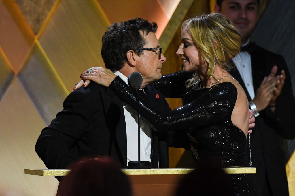 Honoree Canadian-American actor Michael J. Fox hugs his wife Tracy Pollan as he accepts the Jean Hersholt Humanitarian Award during the Academy of Motion Picture Arts and Sciences’ 13th Annual Governors Awards at the Fairmont Century Plaza in Los Angeles on Nov. 19, 2022.
