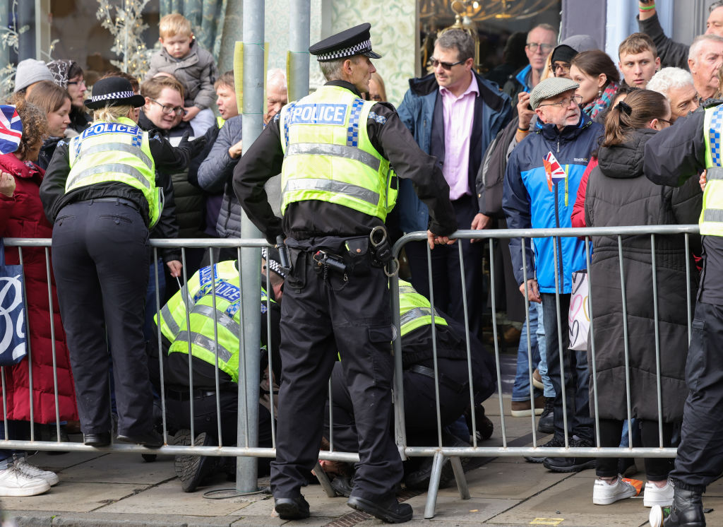 A member of the public is arrested by Police after throwing an egg as King Charles III and Camilla, Queen Consort arrive for the Welcoming Ceremony to the City of York at Micklegate Bar during an official visit to Yorkshire on November 09, 2022 in York, England.