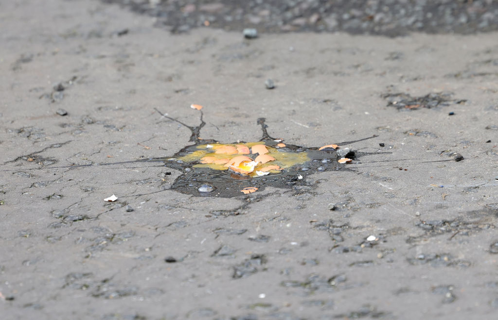 The broken egg thrown by a member of the public as King Charles III and Camilla, Queen Consort arrive for the Welcoming Ceremony to the City of York at Micklegate Bar during an official visit to Yorkshire on November 09, 2022 in York, England.