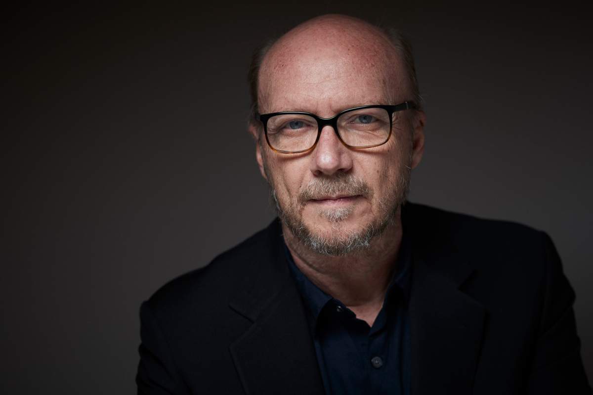 Paul Haggis wearing glasses and a black shirt.