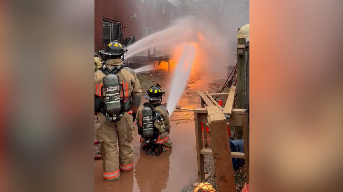 Firefighters battle a blaze caused by a gas leak at a Stoney Creek Townhouse complex Nov. 29, 2022.