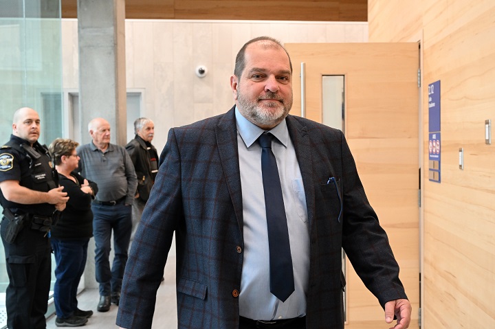 Former Parti Québécois MNA Harold Lebel walks out of the courtroom during a break at the courthouse, in Rimouski, Que., Monday, Nov. 14, 2022. Lebel, who faces charges of sexual assault, is testifying at his trial. 