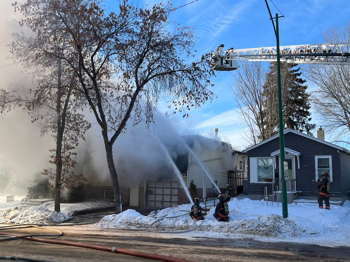 Fire crews battling a house fire in Saskatoon on Thursday.