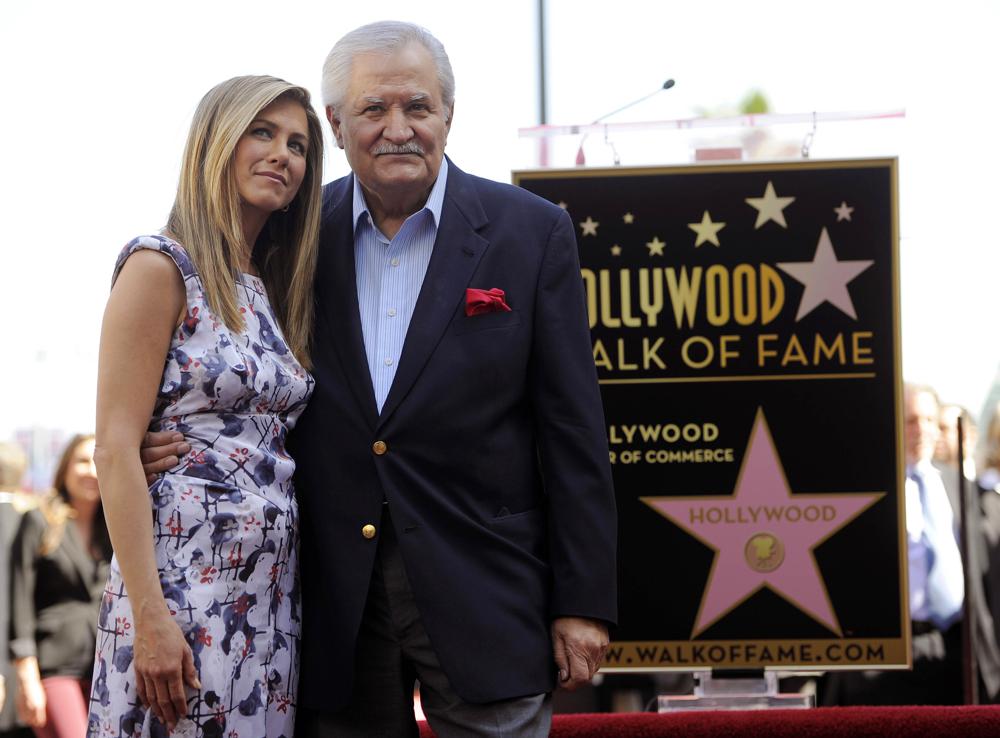 FILE - Actress Jennifer Aniston, left, poses with her father, actor John Aniston, after she received a star on the Hollywood Walk of Fame in Los Angeles on Feb. 23, 2012.