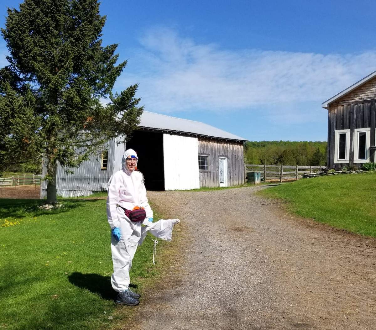 Kirsten Crandall doing field work in her protective gear.