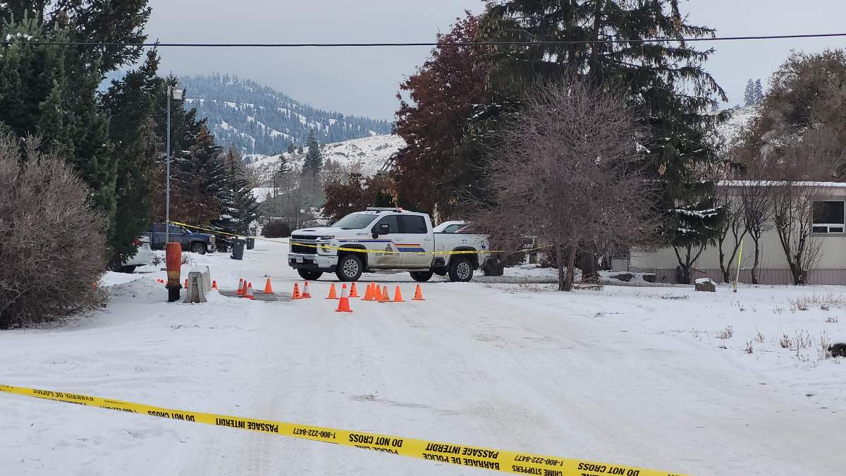 A police truck parked outside a residence following reports of multiple shootings in and around Merritt, B.C.