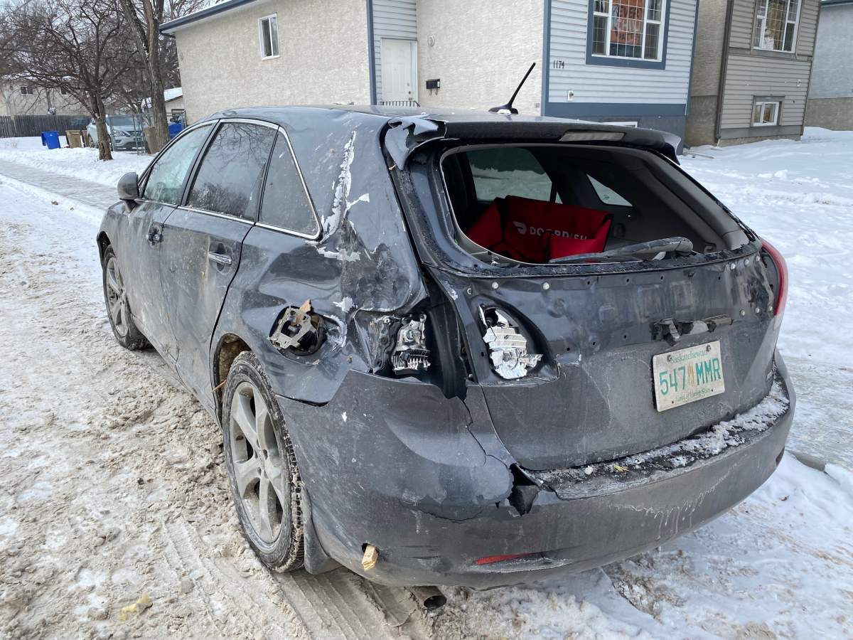 A vehicle across from the explosion can be seen damaged this morning with shattered windows and wood puncturing the vehicle.