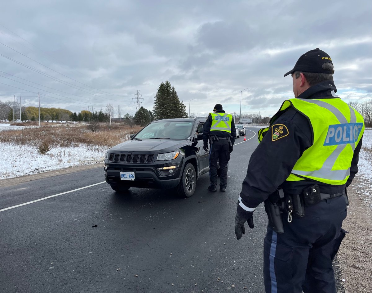 West Region OPP officers stop a vehicle at a RIDE checkpoint along the Colonel Talbot Road exit from Highway 402 in southwest London.