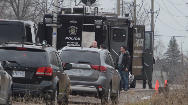 Halton police are on the scene of a suspicious vehicle fire where a body was found.