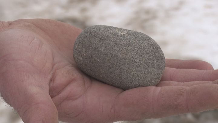 A photo oof a rock that went through a Calgary man’s truck window.