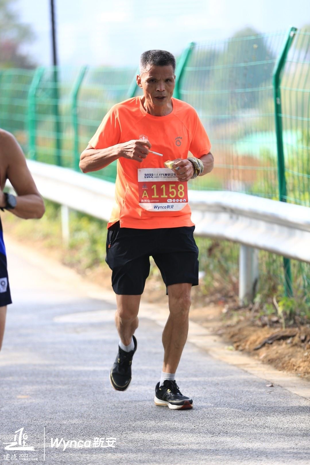 Uncle Chen seen chain-smoking during the Xin’anjiang Marathon.