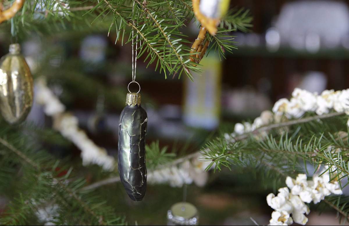 In this photo taken Tuesday, Oct. 20, 2015, ornaments hang on the Popcorn, Peanut, Pretzel and Pickle Tree on display at the Jimtown Store in Healdsburg, Calif.