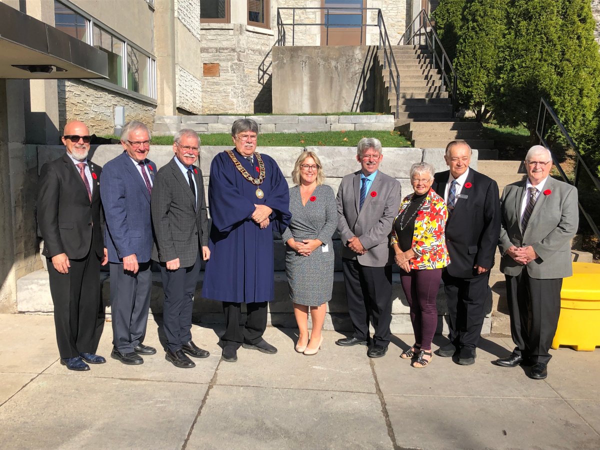 Eight outgoing Peterborough County councillors pose for a photo with CAO Sheridan Graham outside of the council chambers on Nov. 2, 2022.