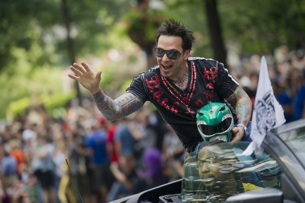 FILE - Jason David Frank waves to the crowd as he makes his way down Peachtree Street in the annual DragonCon parade through downtown Atlanta, on Aug. 31, 2013. Frank, who played the Green Power Ranger Tommy Oliver on the 1990s children's series “Mighty Morphin Power Rangers," has died, according to a statement Sunday, Nov. 20, 2022, from his manager, Justine Hunt. He was 49. 