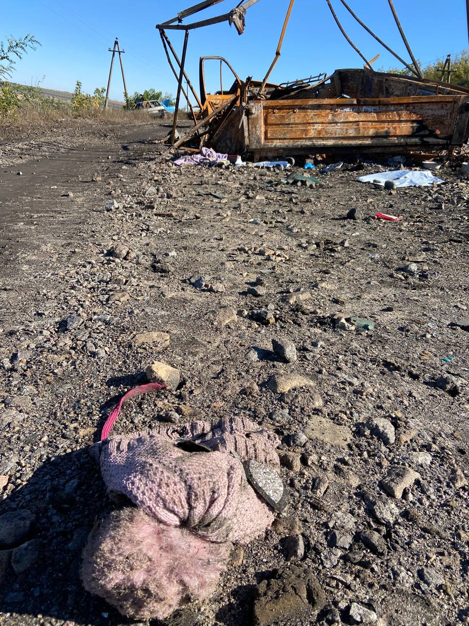 A child’s hat on the road where Russian forces shelled a civilian convoy on Sept. 25.