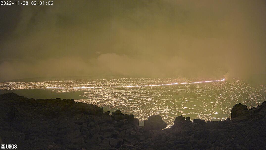 This image provided by the USGS Hawaiian Volcano Observatory shows a view from a research camera on the north rim of the summit caldera of the Mauna Loa volcano, Monday, Nov. 28, 2022.