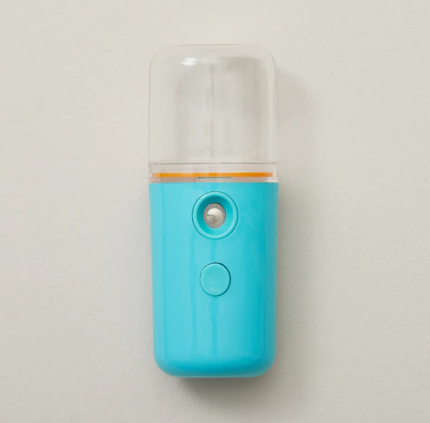 A blue portable humidifier. 