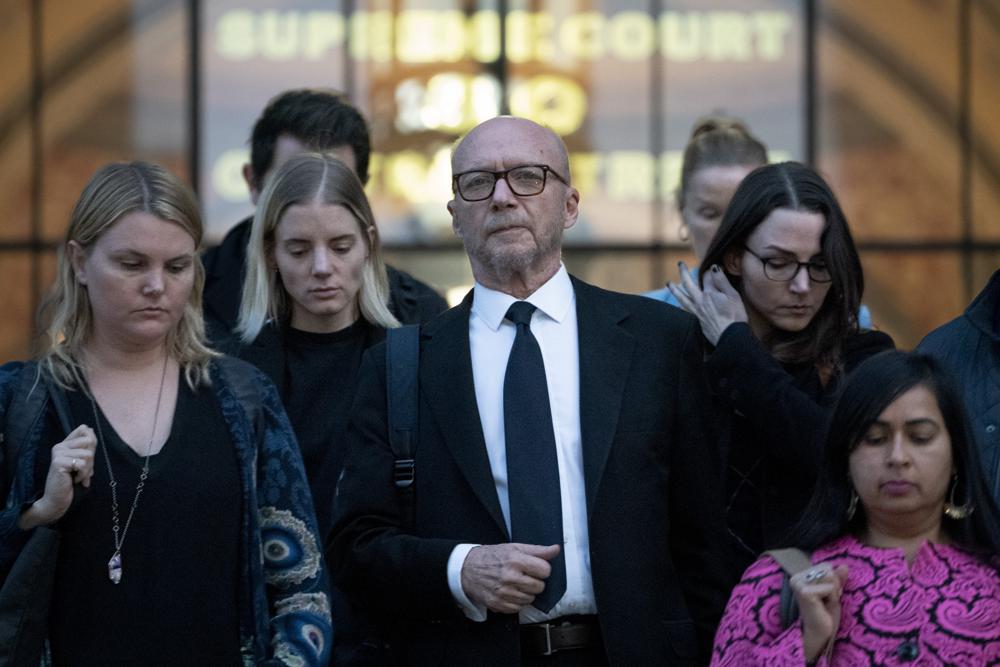 Paul Haggis and others leave the courthouse.