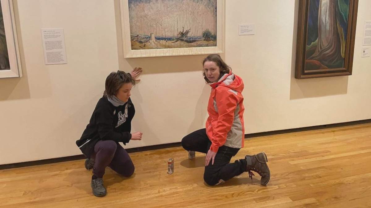 Two apparent climate change activists have apparently defaced a painting at the Vancouver Art Gallery.