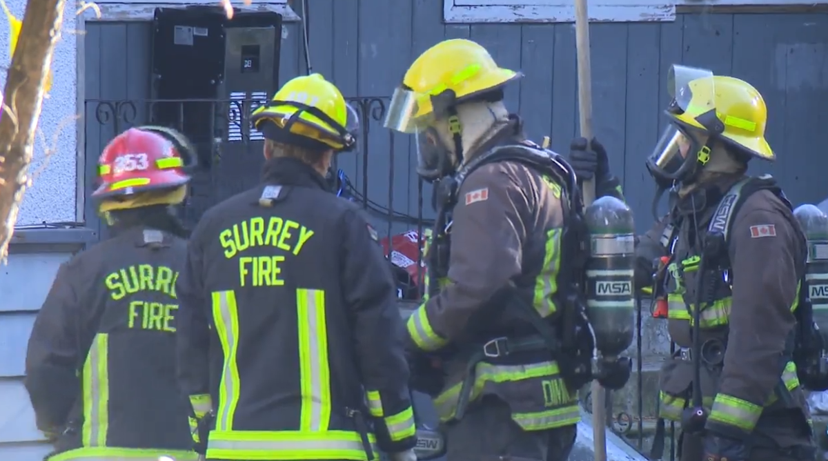 Crews at the scene of a Surrey house fire on Wednesday, Nov. 9, 2022. 