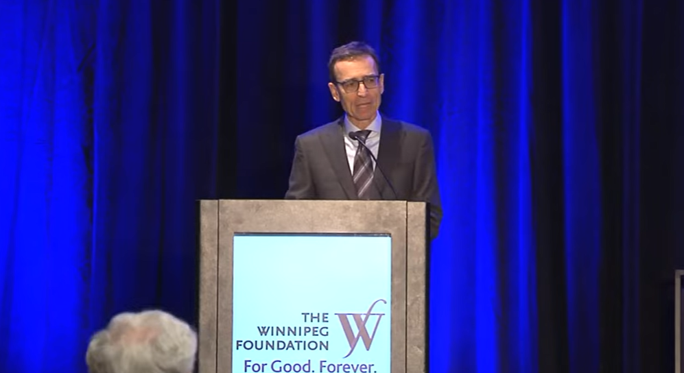 The Winnipeg Foundation's Tom Bryk announces the gift.