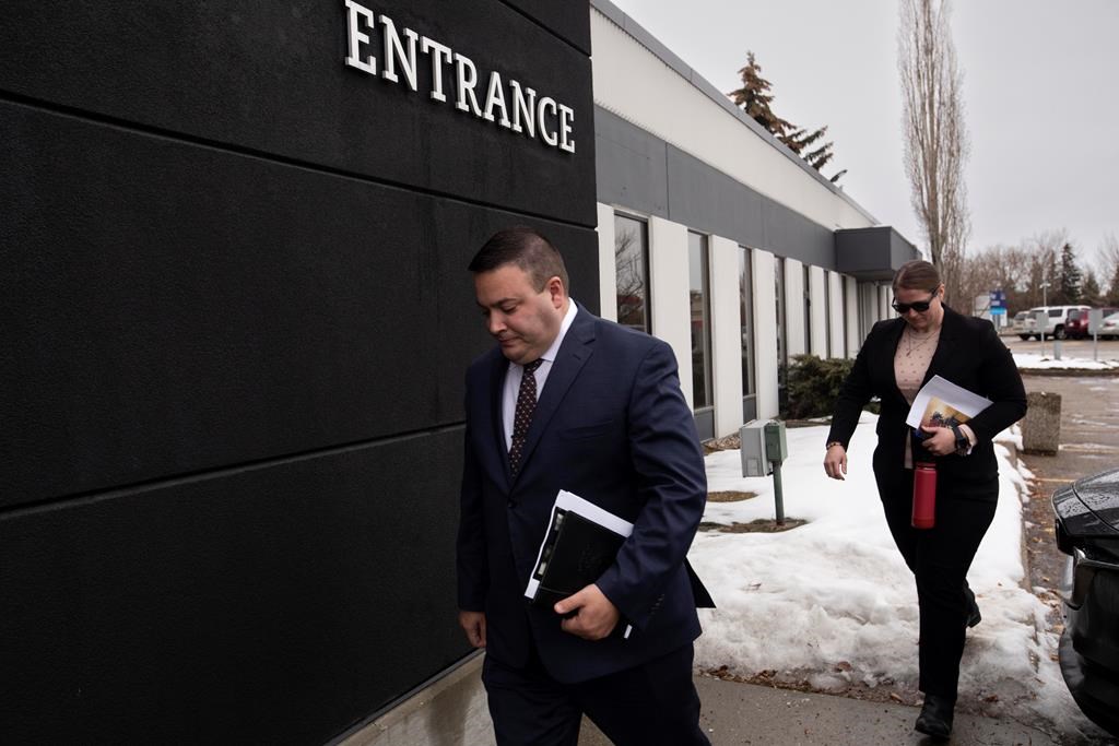 Cpl. Randy Stenger, left, and Const. Jessica Brown, return to court to resume their jury trial on charges of manslaughter with a firearm and aggravated assault, in Edmonton on Friday, Nov. 25, 2022.