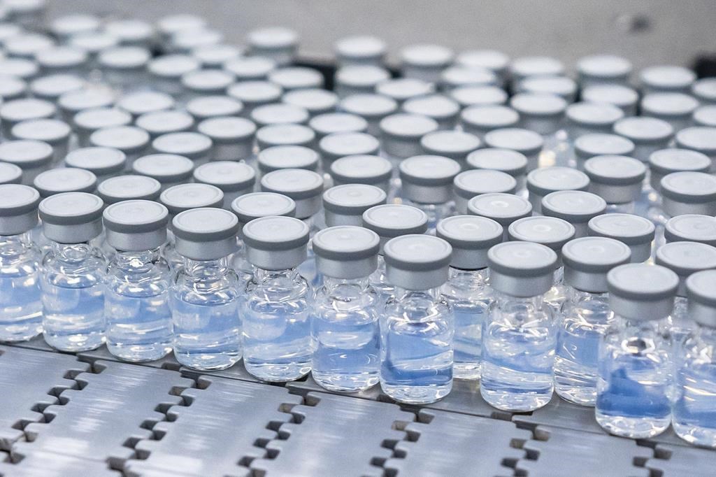 Vials of Pfizer's updated COVID-19 vaccine are seen during production in Kalamazoo, Mich., in an Aug. 2022, handout photo.