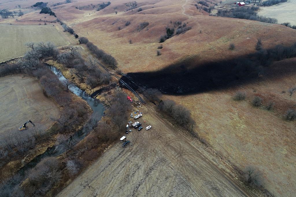 In this photo taken by a drone, cleanup continues in the area where the ruptured Keystone pipeline dumped oil into a creek in Washington County, Kan., Friday, Dec. 9, 2022.