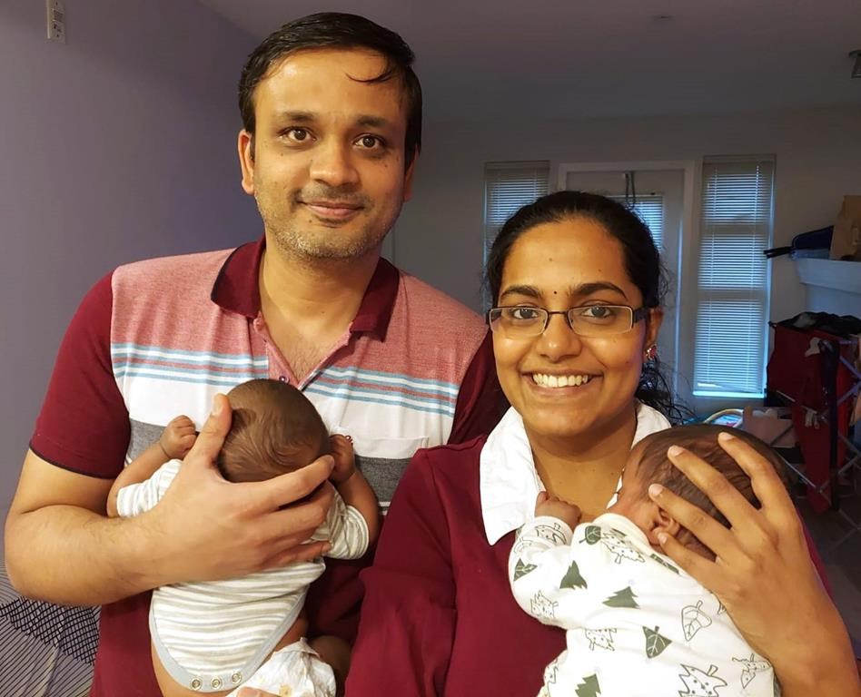 Preethi Krishnan, right, holds her daughter Sudha, as her husband, Ashok Narasimhan, holds twin sister Shraddha in this undated handout photo. The couple took comfort in seeing their premature babies in hospital in between daily visits, thanks to cameras installed at the infants' bedsides at Richmond Hospital. THE CANADIAN PRESS/HO, Preethi Krishnan*MANDATORY CREDIT*.
