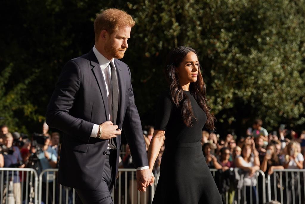 Meghan, Duchess of Sussex and Prince Harry meet members of the public at Windsor Castle, following the death of Queen Elizabeth II on Thursday, in Windsor, England, Saturday, Sept. 10, 2022.
