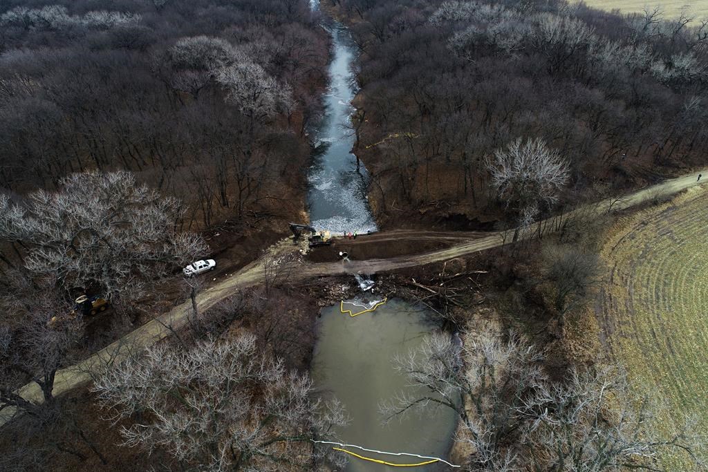 In this photo taken by a drone, cleanup continues in the area where the ruptured Keystone pipeline dumped oil into a creek in Washington County, Kan., Friday, Dec. 9, 2022.