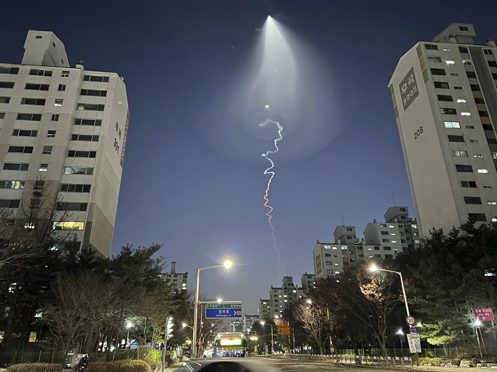 The light trail is seen in Goyang, South Korea, Friday, Dec. 30, 2022.