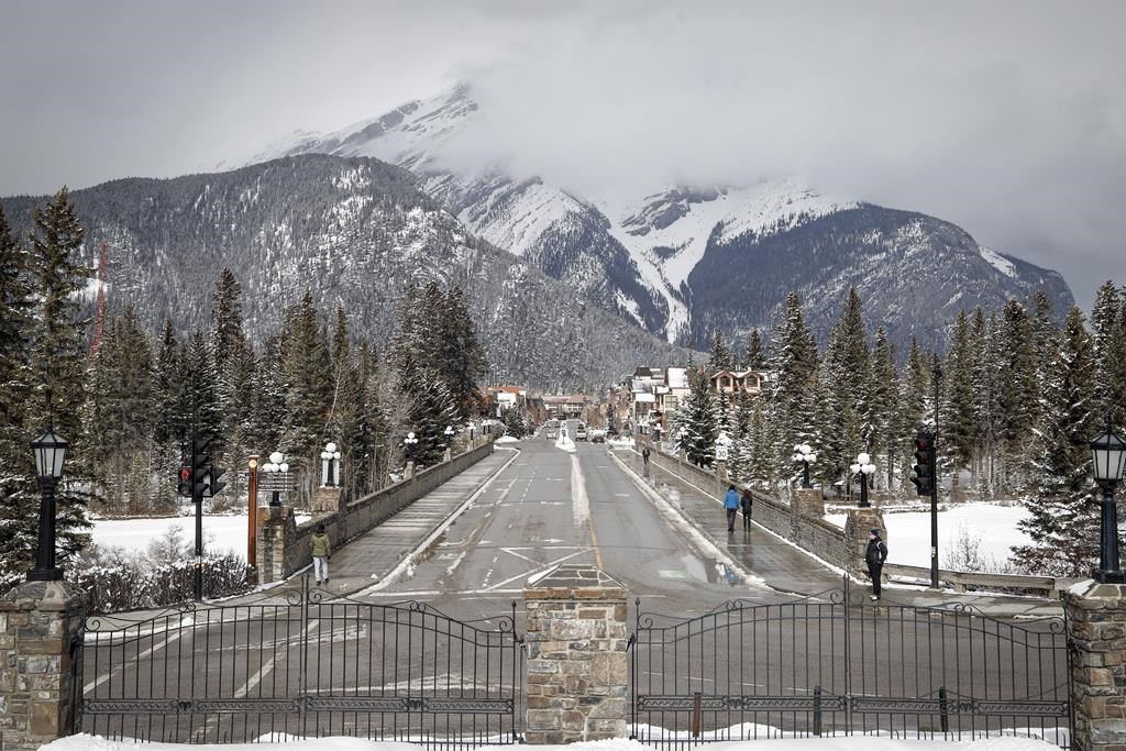 The empty streets of Banff are seen as Parks Canada is restricting vehicles in the national parks and national historic sites in Banff, Alta., Tuesday, March 24, 2020. More than 400 people in Banff were without power after a thunderstorm on Monday afternoon. THE CANADIAN PRESS/Jeff McIntosh.