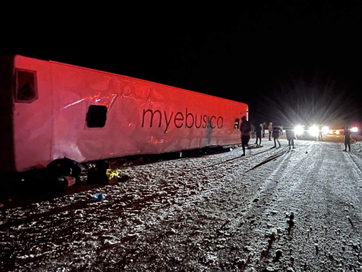 A photo of the bus on its side.