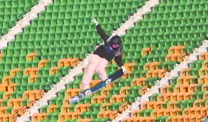 A snowboarder tests a massive jump at Edmonton’s Commonwealth Stadium on Dec. 7, 2022.