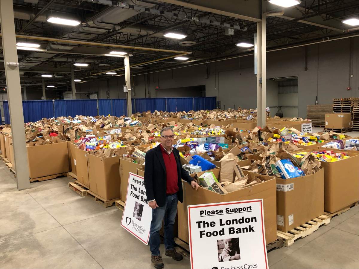 Business Cares Food Drive chair Wayne Dunn with 2022 donations leading into the final week of the campaign.