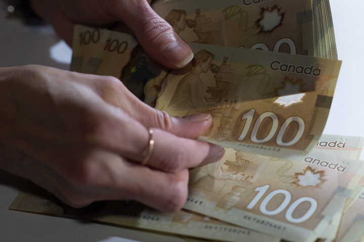 Canadian $100 bills are counted in Toronto, Feb. 2, 2016. 