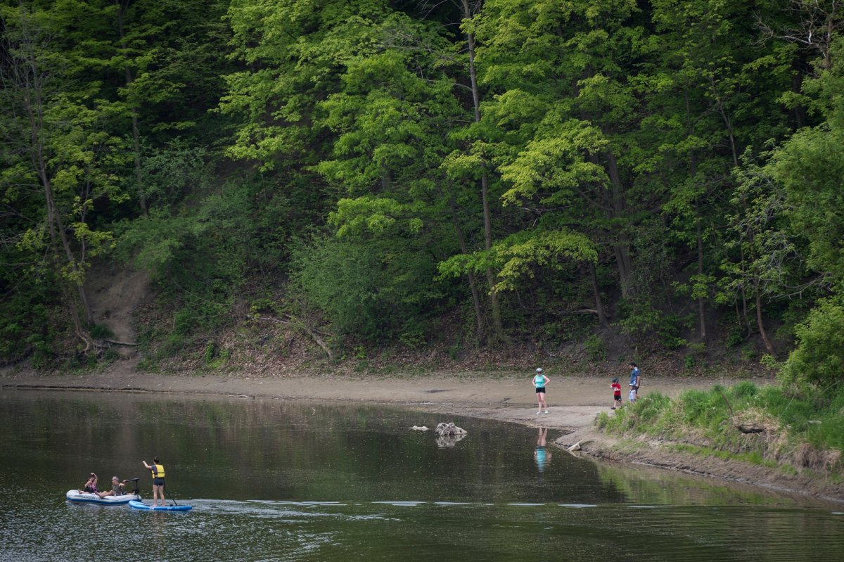 People spend part of the May long weekend on the Humber River in Toronto during the COVID-19 pandemic on Saturday, May 22, 2021.  THE CANADIAN PRESS/ Tijana Martin.