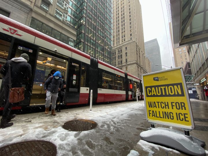 Passengers step off a streetcar during a snowy day in Toronto on Tuesday, Nov.15, 2022. Environment Canada is issuing its first winter weather travel advisory of the season for much of southern Ontario, including the Greater Toronto Area. 