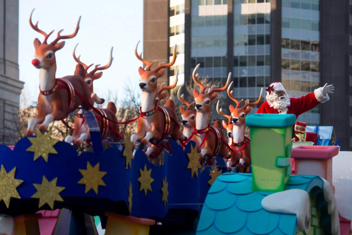Santa Claus waves to the crowd from his float during the Santa Claus parade in Toronto on Sunday, Nov. 15, 2015. Santa Claus is moving to prime time in Toronto.The city's annual Santa Claus parade will go broadcast-only this year, with a two-hour show set for the evening of Saturday, Dec. 5. THE CANADIAN PRESS/Marta Iwanek.