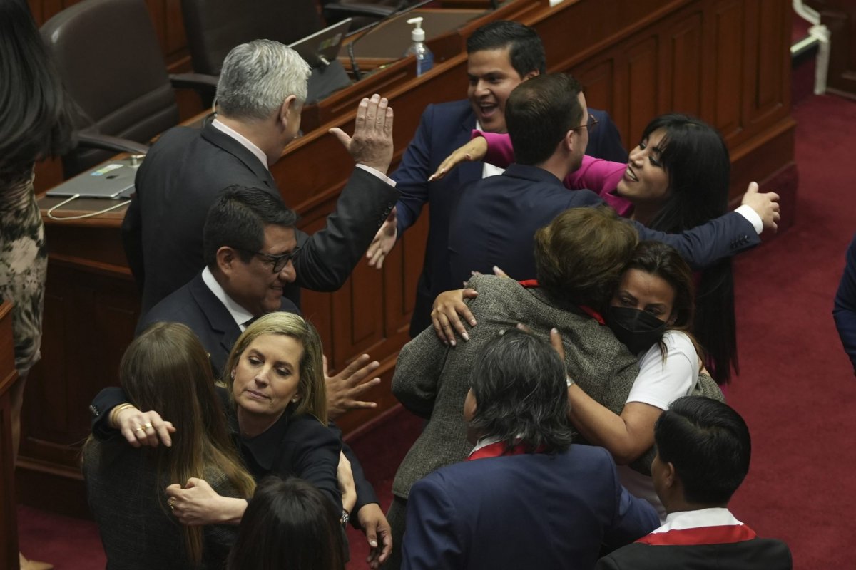 Lawmakers celebrate after verbally voting to remove President Pedro Castillo from office in Lima, Peru, Wednesday, Dec. 7, 2022. Peru’s Congress voted to remove Castillo from office Wednesday and replace him with the vice president, shortly after Castillo tried to dissolve the legislature ahead of a scheduled vote to remove him.(AP Photo/Guadalupe Pardo)