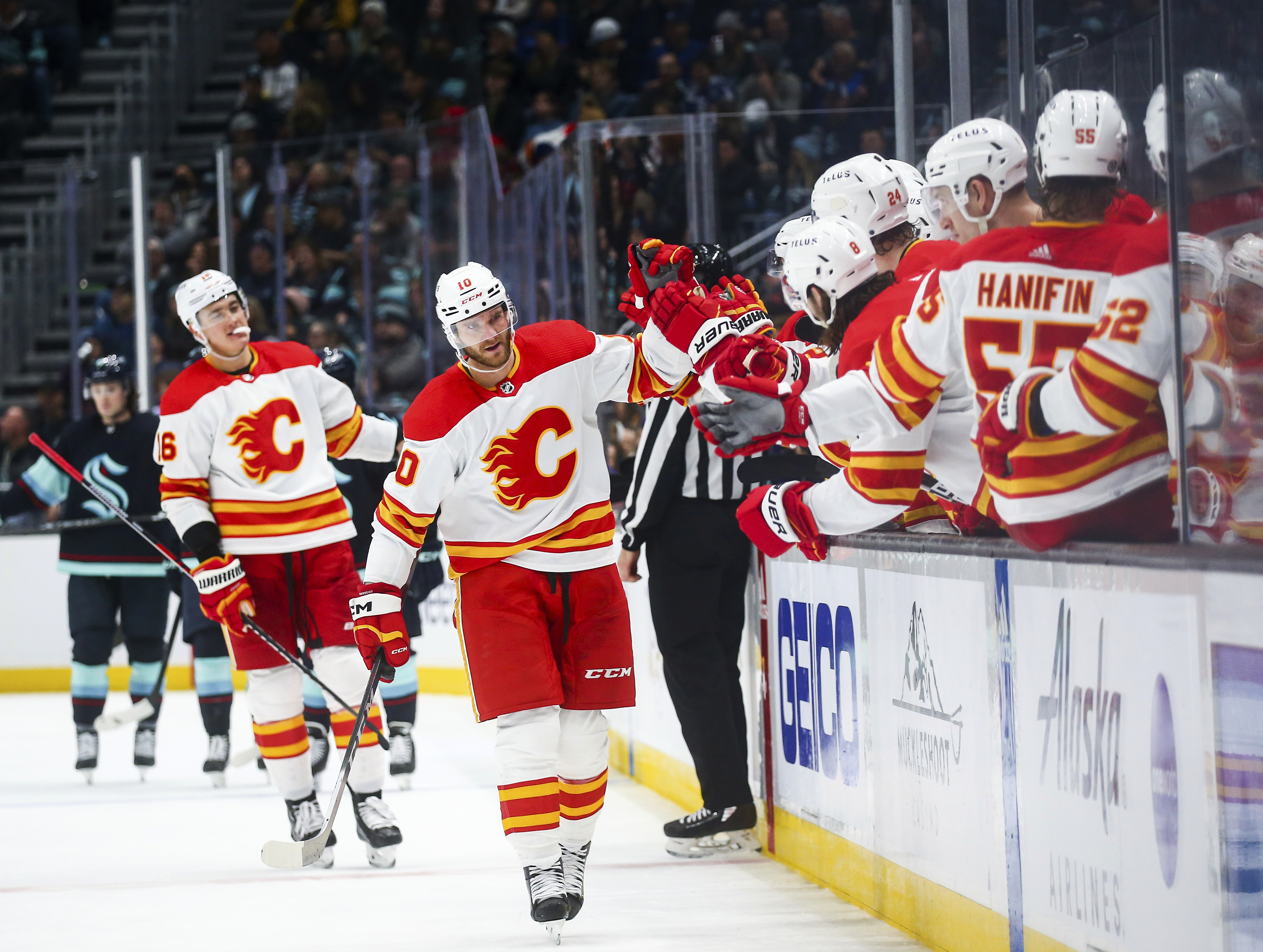 Kraken score 3 goals in 3rd period for 1st win over Flames - The