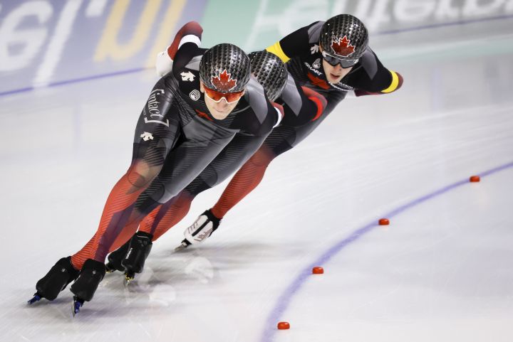 Canada's Antoine Gelinas-Beaulieu, right, Connor Howe, centre, and Tyson Langelaar skate during the men's team pursuit competition at the ISU World Cup speed skating event in Calgary, Alta., Friday, Dec. 9, 2022.