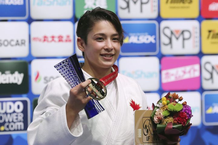Gold medallist Christa Deguchi of Canada poses for a photo during the award ceremony of the women's -57 kilogram class of the World Judo Championships in Tokyo, Tuesday, Aug. 27, 2019. 
