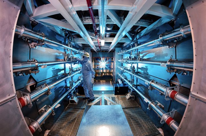 In this 2012 image provided by Lawrence Livermore National Laboratory, a technician reviews an optic inside the preamplifier support structure at the Lawrence Livermore National Laboratory in Livermore, Calif.