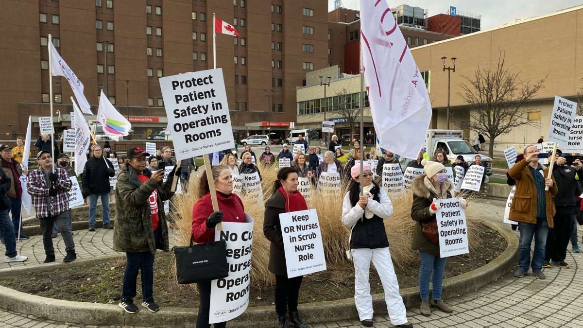 More than a hundred people rallied in front of the Hamilton General Hospital to protest a decision to add operating room assistants, claiming it jeopardizes the roles of registered nurses.