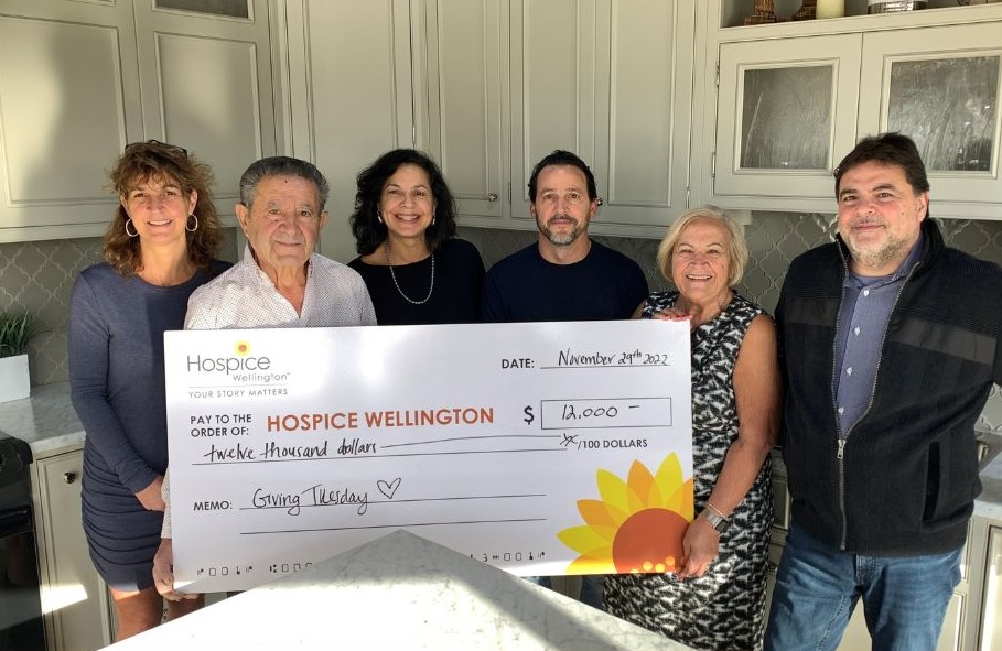 Barzotti Woodworking presents a cheque for $12,000 to Hospice Wellington. The amount is to match donations made in Giving Tuesday initiative.