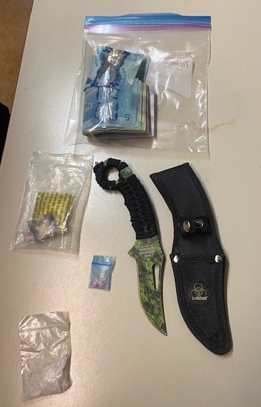 Police say a man was found to be carrying cocaine, methamphetamine, fentanyl, a knife and cash while attending a court house in Portage La Prairie, Man.