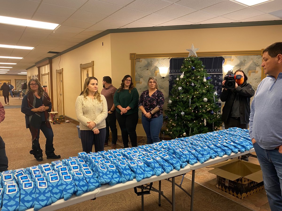 McKercher donates socks to the visitors of the new Saskatoon Tribal Council emergency wellness centre.