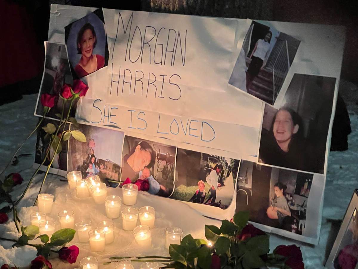 Photos remembering homicide victim Morgan Harris are seen at a vigil Thursday night.